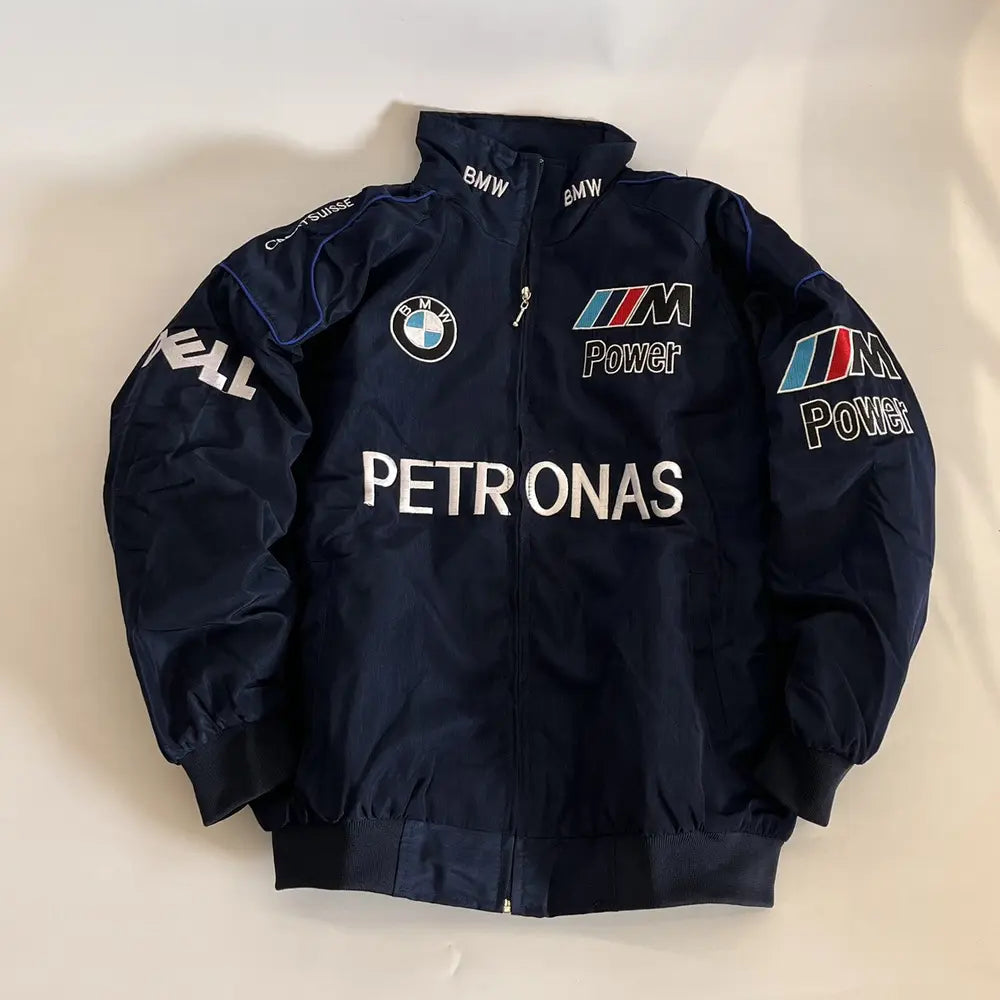 Navy blue jacket with BMW and Petronas logos on a light beige background