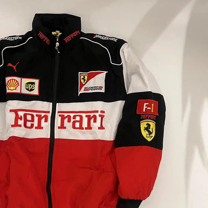 Ferrari racing suit with various logos on a white background
