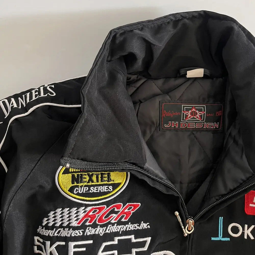 Black racing jacket with various logos on a white background