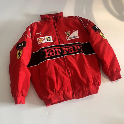 Red Ferrari jacket with various logos on a white background