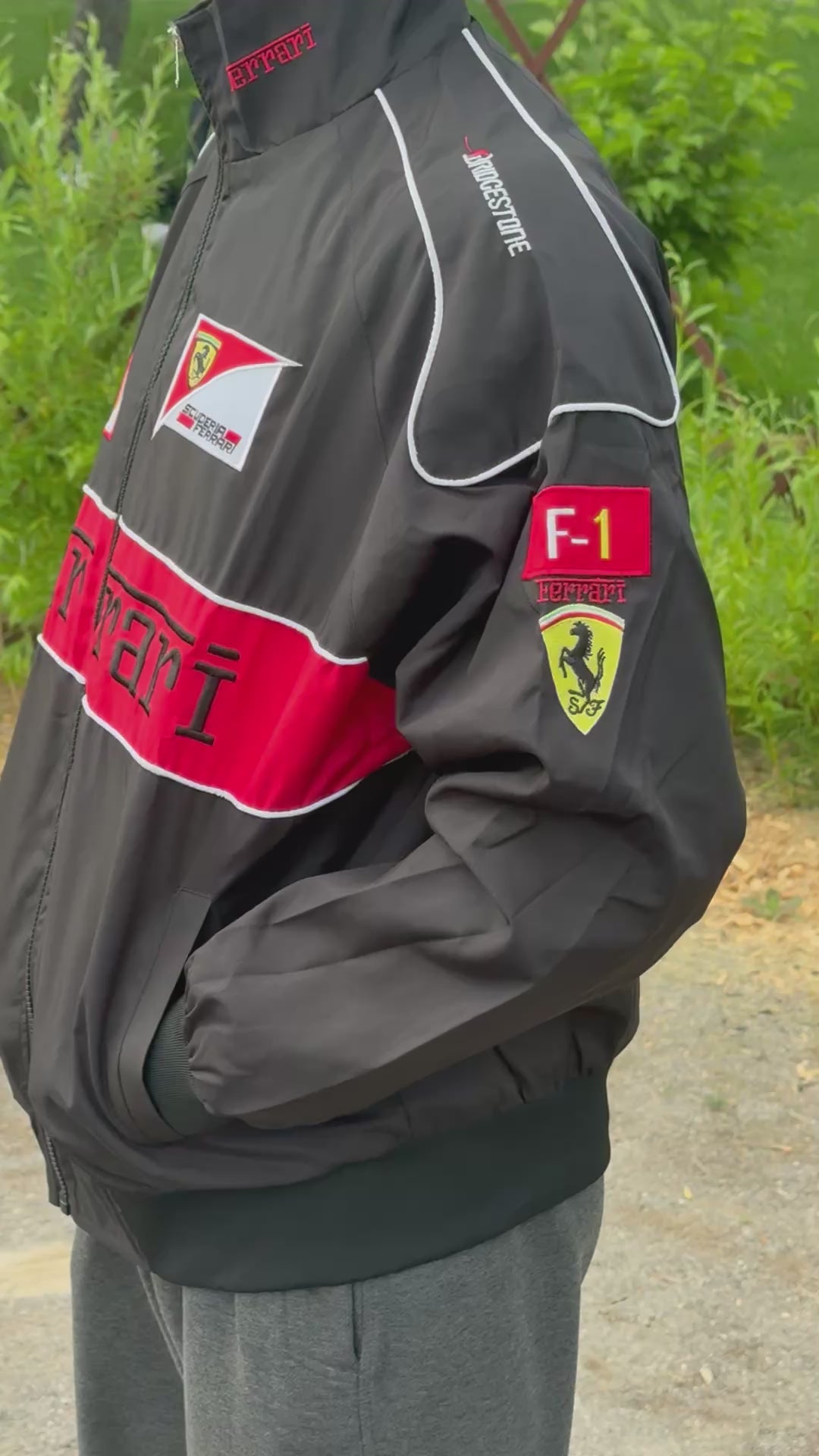 Model wearing Thick Black Ferrari F1 Racing Jacket – Padded Motorsport Streetwear with Embroidered Ferrari Logos, Premium Formula 1 Fan Apparel by Turn One Jackets, showcasing fit, style, and quality