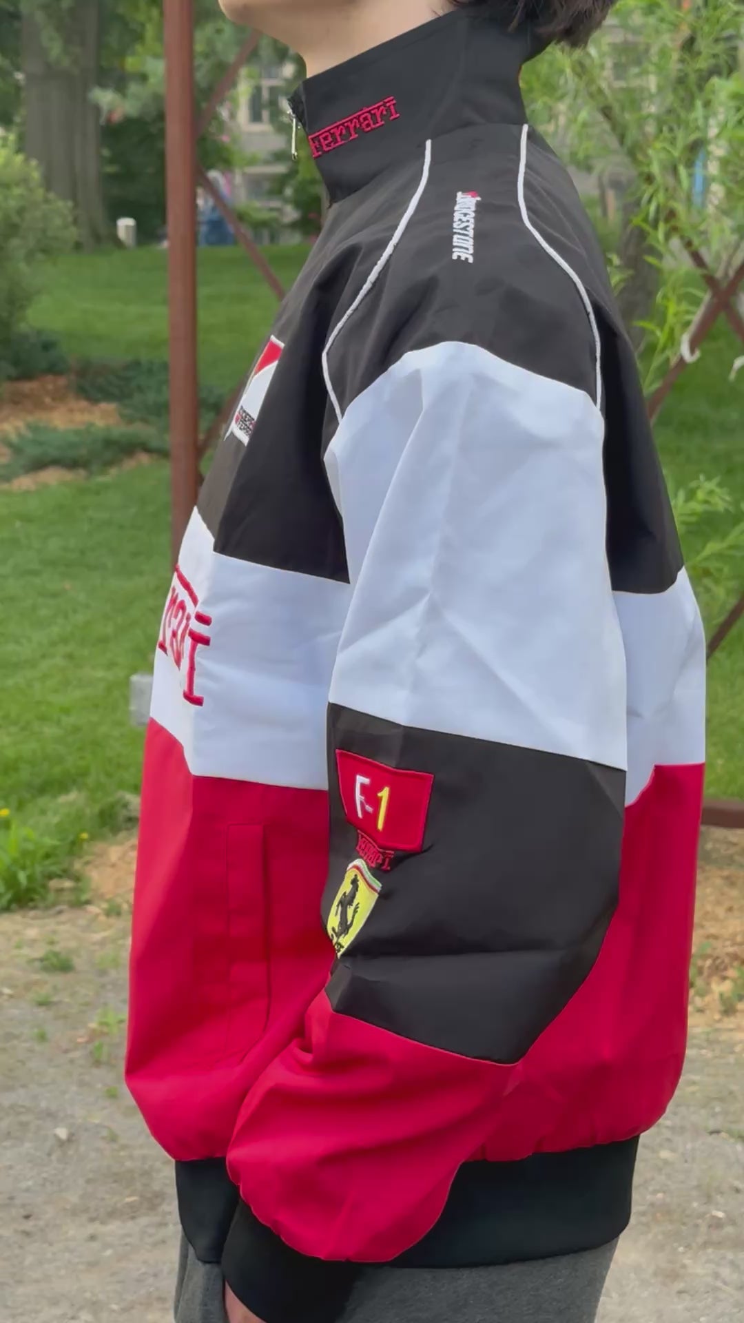 Model wearing White Ferrari F1 Racing Jacket –Motorsport Streetwear with Embroidered Ferrari Logos, Premium Formula 1 Fan Apparel by Turn One Jackets, showcasing fit, style, and quality