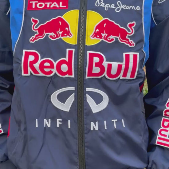 Model wearing Blue Red Bull F1 Racing Jacket – Motorsport Streetwear with Embroidered Red Bull Logos, Premium Formula 1 Fan Apparel by Turn One Jackets, showcasing fit, style, and quality