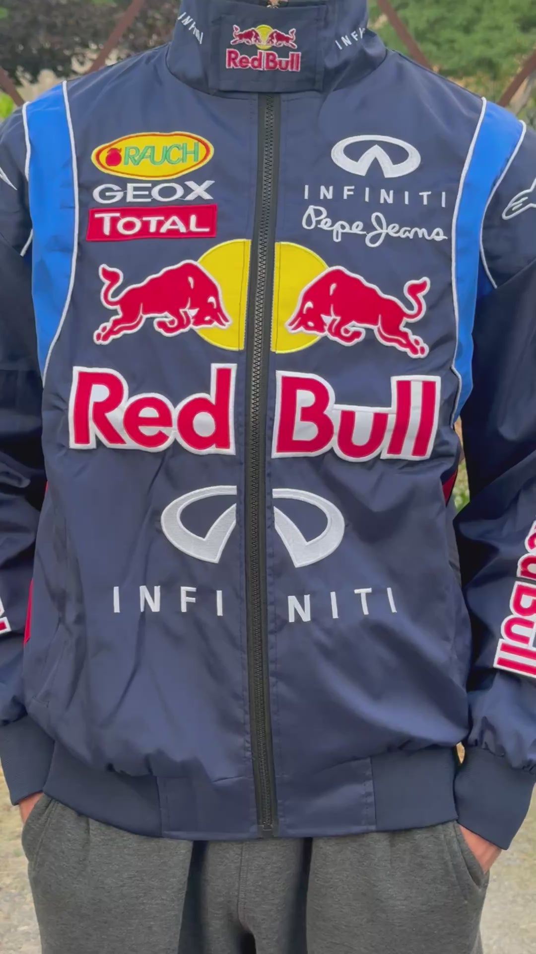 Model wearing Blue Red Bull F1 Racing Jacket – Motorsport Streetwear with Embroidered Red Bull Logos, Premium Formula 1 Fan Apparel by Turn One Jackets, showcasing fit, style, and quality